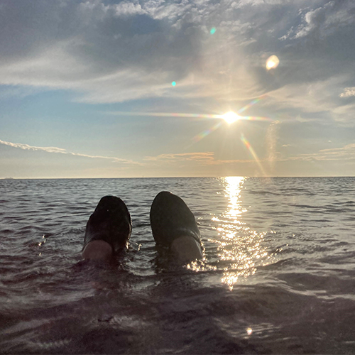 Emily's feet sticking out of sea-summer activity ideas-slimming world blog