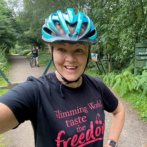 Woman wearing bike helmet-slimming world's summer of love challenge