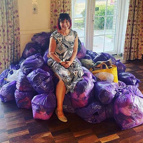 Slimming World member sitting on charity bags-slimming world's summer of love challenge