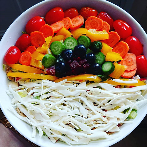Rainbow salad in white bowl-slimming world's summer of love challenge