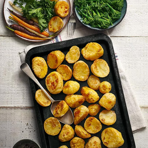 roast potatoes on black baking tray-time-saving side dishes-slimming world blog