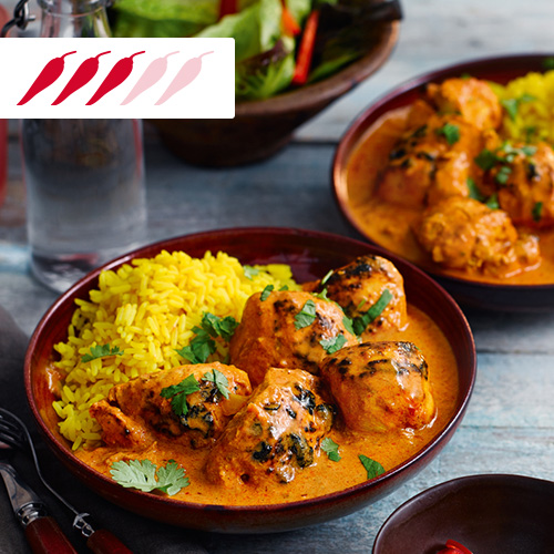 Chicken tikka masala with pilau rice in brown bowl-slimming world curry recipes