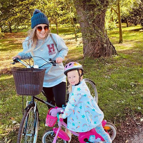 Slimming World member riding a bike with daughter