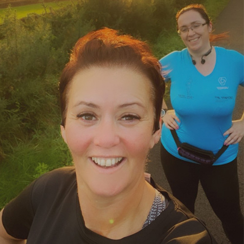 Slimming World member running with a friend
