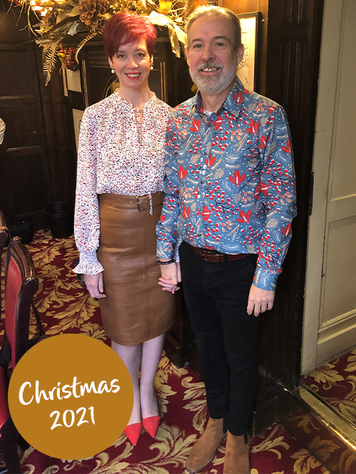 Kirsty and Roger Cound-Slimming World members after weight loss photo-Christmas backdrop