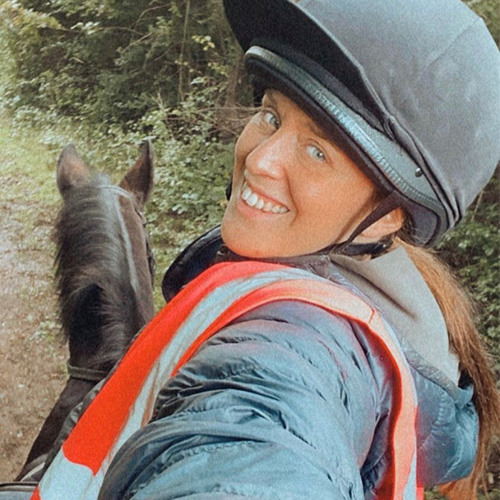 Ro taking a selfie while riding her horse