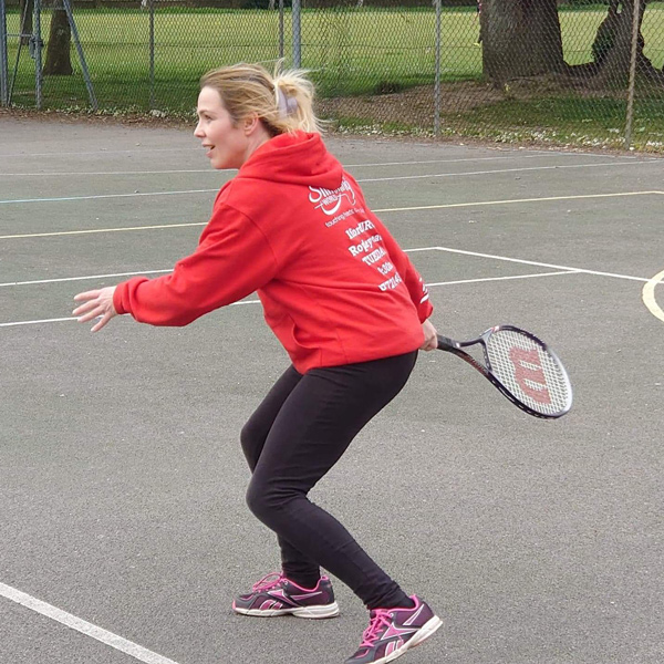 Image shows Slimming World member playing tennis