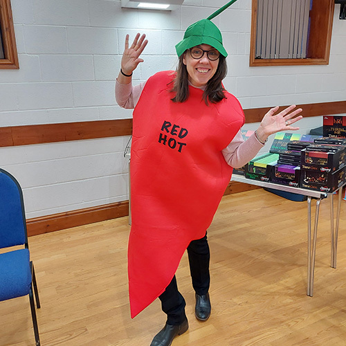 Slimming World Consultant Caroline wearing a chilli pepper outfit