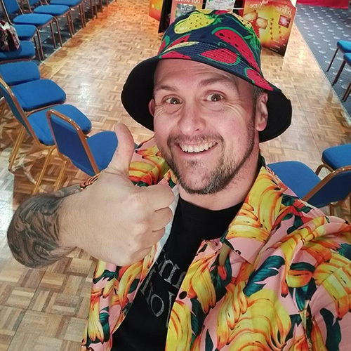 Slimming World Consultant Jason wearing fruit themed hat and jacket