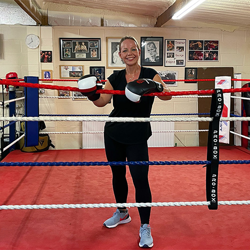 Slimming World member Amy Smith standing in a boxing ring