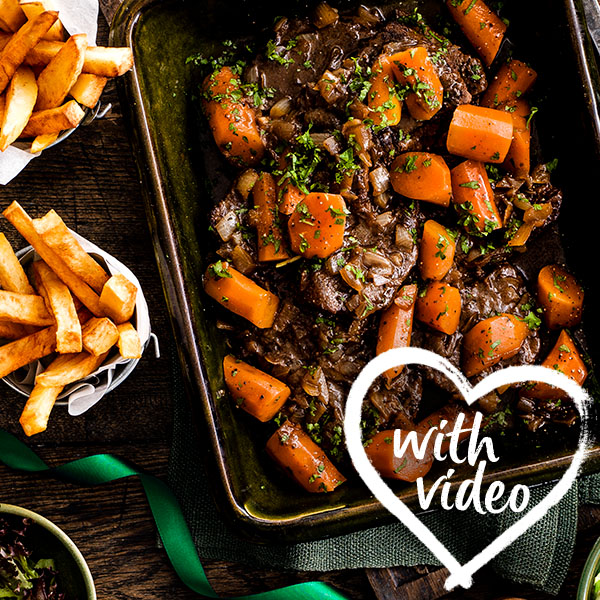 Slimming World Guinness braised steak and chips. Text reads with video