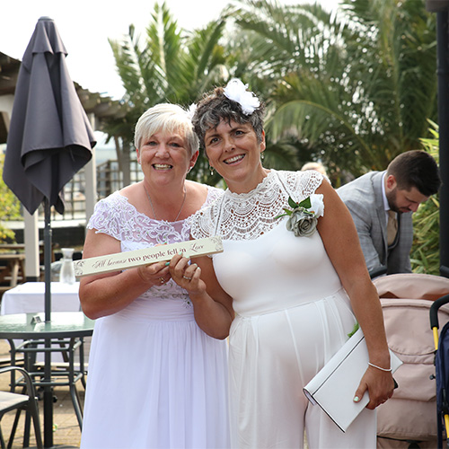 Alex Newams and her wife on their wedding day