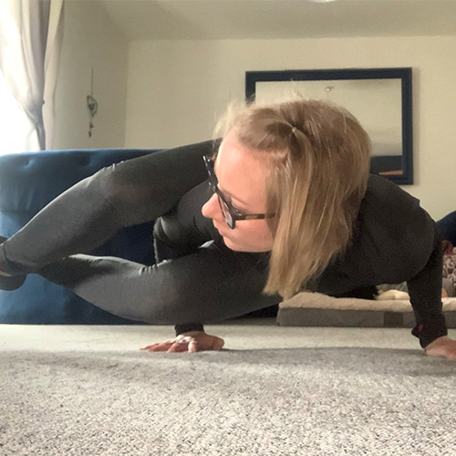 Slimming World member Carter performing yoga in her living room