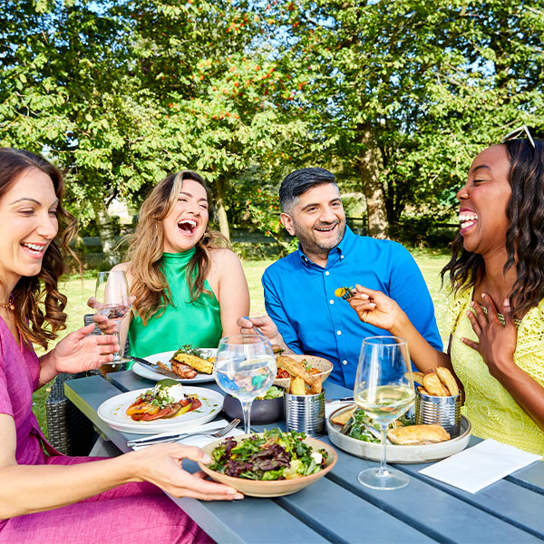 Slimming World members eating out in a pub garden