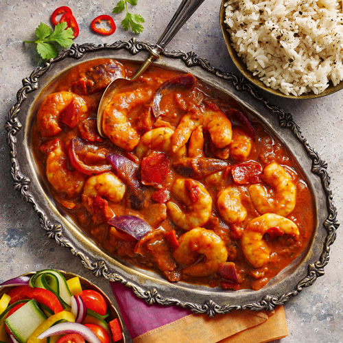 Slimming World king prawn bhuna on a grey platter on a light grey background