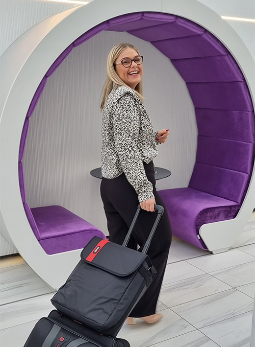 Slimming World Consultant Laura Allen pulling her suitcase at head office