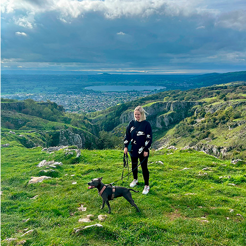 Slimming World member Lauren walking her dog in the countryside