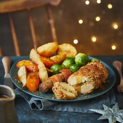 Cheesy leek-stuffed Quorn with maple ‘pigs in blankets’