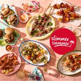 Spread of Slimming World barbecue food including burgers, veggie burgers and kebab skewers