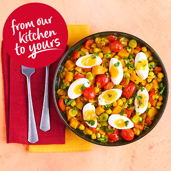 Slimming World Kitchen's curried chickpeas with jammy eggs recipe. A red sticker in the top right corner reads: from our kitchen to yours.