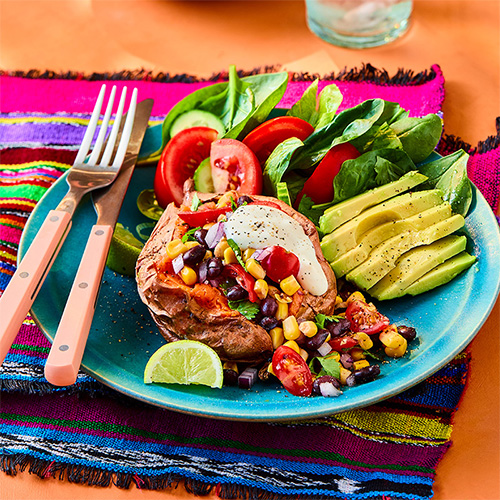 Baked sweet potatoes with black bean salsa and avocado