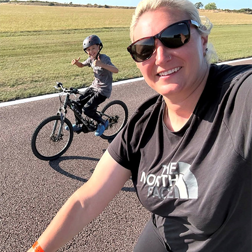 Member India Harris with son bike riding - Easter activity