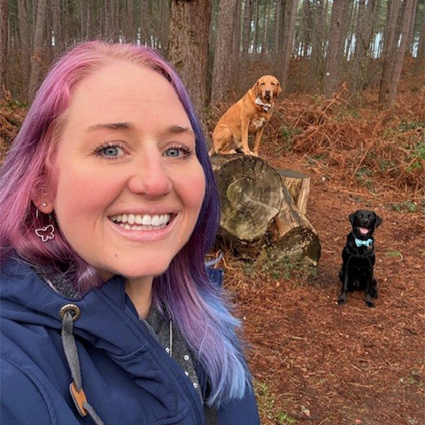 woman walking with two dogs