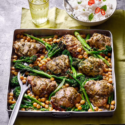 Thai green chicken bake served with a bowl of rice dotted with sliced red chillies