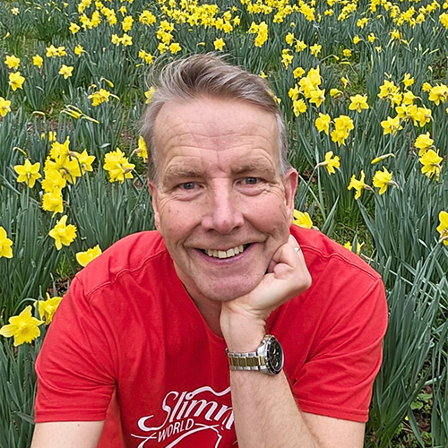 Slimming World member in a field of daffodils