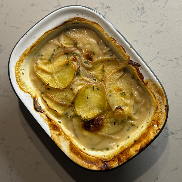 Cheesy dauphinoise potatoes – one of three Slimming World recipes made with Seriously Spreadable Lighter cheese